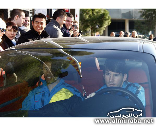 Barcelona's player Lionel Messi drives his car after the training session at Nou Camp stadium in Barcelona