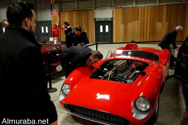 Visitors look at a red 1957 Ferrari 335 Sport Scaglietti model on display at the Paris Retromobile fair in Paris, France, February 5, 2016.  REUTERS/Philippe Wojazer