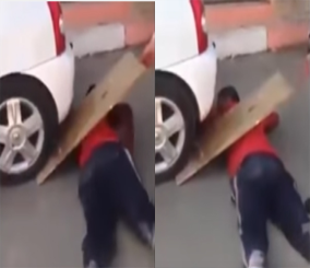 "فيديو" شاهد شاب يسمح لسيارة بالمرور فوقه في تحد خطير 6